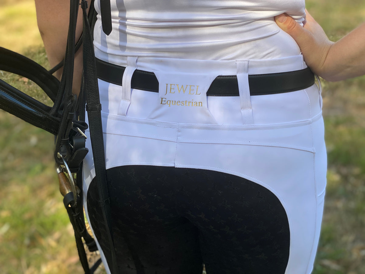 White competition riding tights with black full seat for dressage and showing